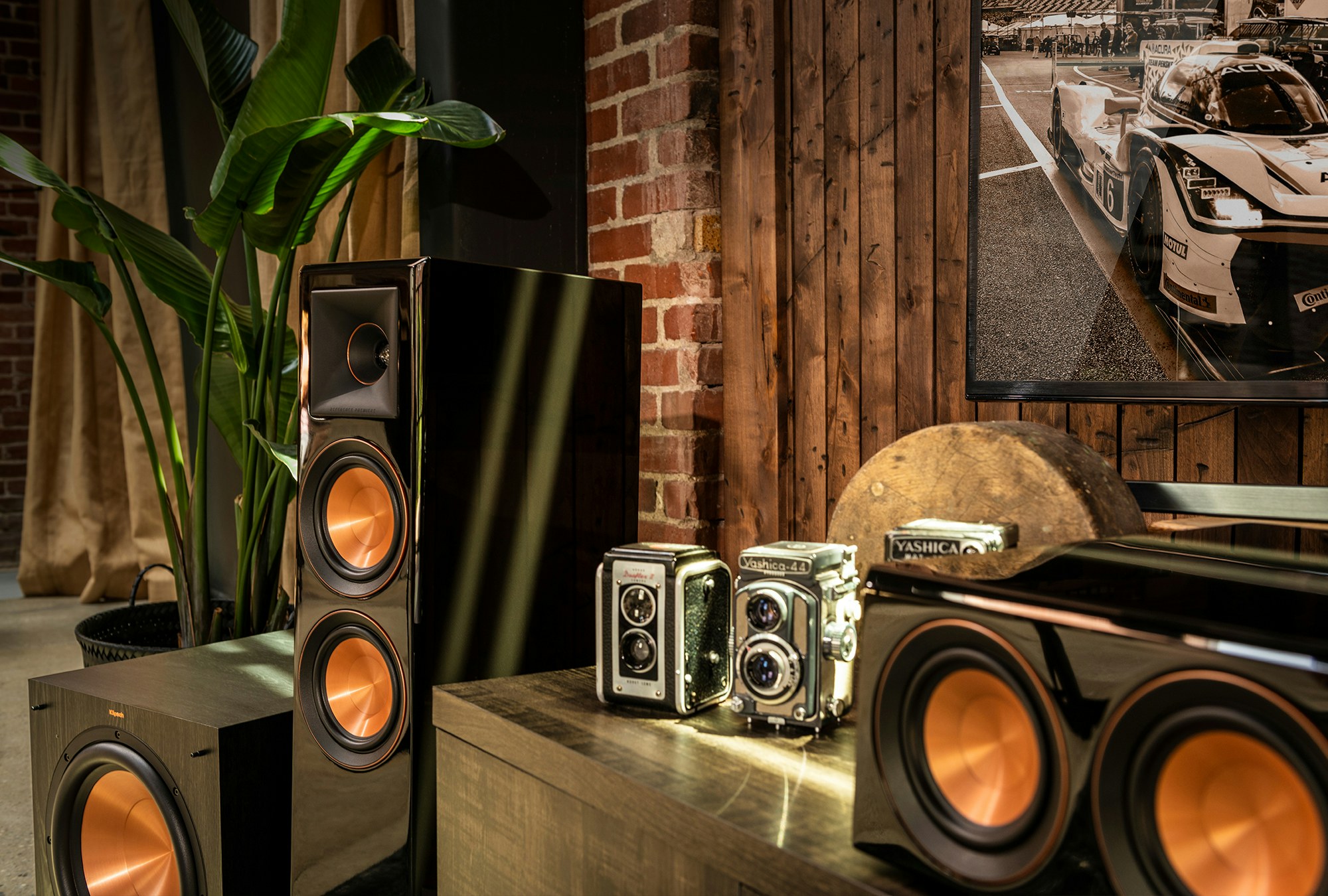 Close up of a Klipsch speaker system surrounding a tv